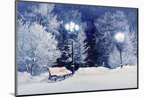 Winter Night Landscape Scene of Snow Covered Bench among Snowy Trees and Shining Lights during Snow-Marina Zezelina-Mounted Photographic Print