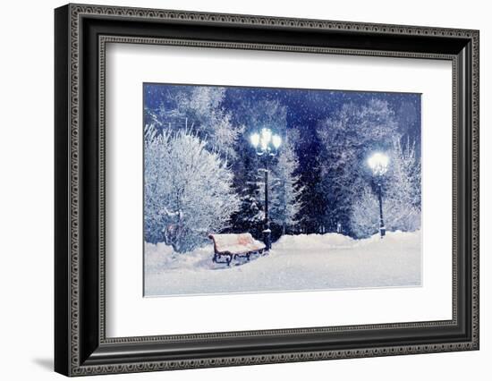 Winter Night Landscape Scene of Snow Covered Bench among Snowy Trees and Shining Lights during Snow-Marina Zezelina-Framed Photographic Print