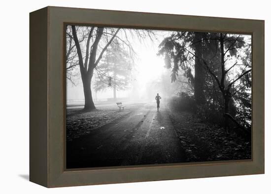 Winter Scene with Male Figure Jogging in Park-Sharon Wish-Framed Premier Image Canvas