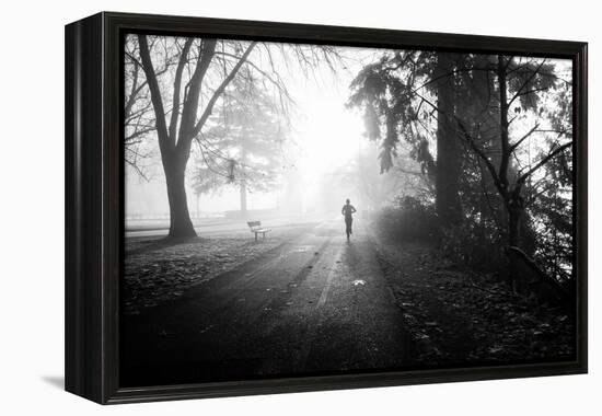 Winter Scene with Male Figure Jogging in Park-Sharon Wish-Framed Premier Image Canvas