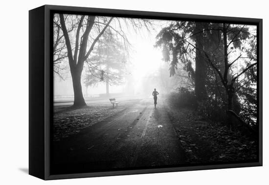 Winter Scene with Male Figure Jogging in Park-Sharon Wish-Framed Premier Image Canvas