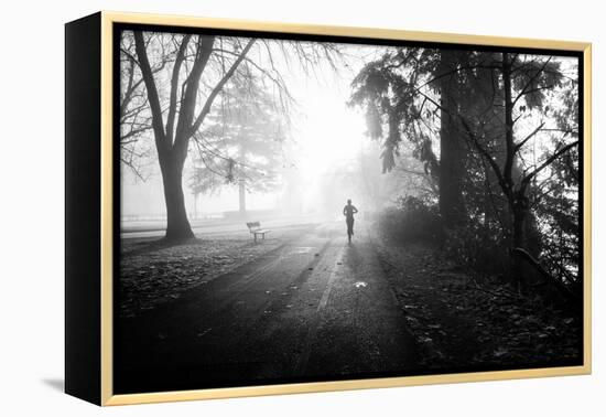 Winter Scene with Male Figure Jogging in Park-Sharon Wish-Framed Premier Image Canvas