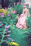 A Beautiful Princess with Long Blond Hair Wanders Through a Garden of Pretty Flowers-Winter Wolf-Photographic Print