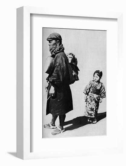 ''With his drum and monkey he is Japan's equivalent to our old-style organ grinder', c1900, (1921)-Julian Leonard Street-Framed Photographic Print