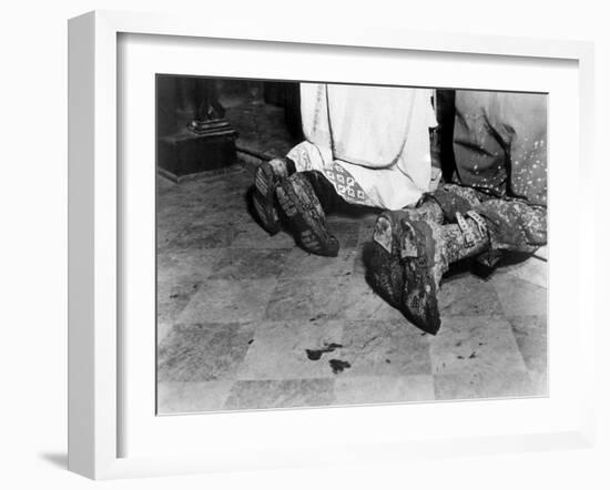 With Soiled Army Boots, a Chaplain and Soldier Kneel at Catholic Mass Is Held for Two Dead Soldiers-null-Framed Photo