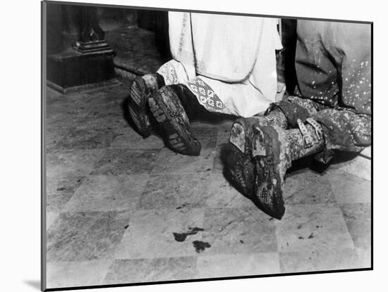 With Soiled Army Boots, a Chaplain and Soldier Kneel at Catholic Mass Is Held for Two Dead Soldiers-null-Mounted Photo