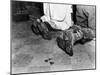 With Soiled Army Boots, a Chaplain and Soldier Kneel at Catholic Mass Is Held for Two Dead Soldiers-null-Mounted Photo