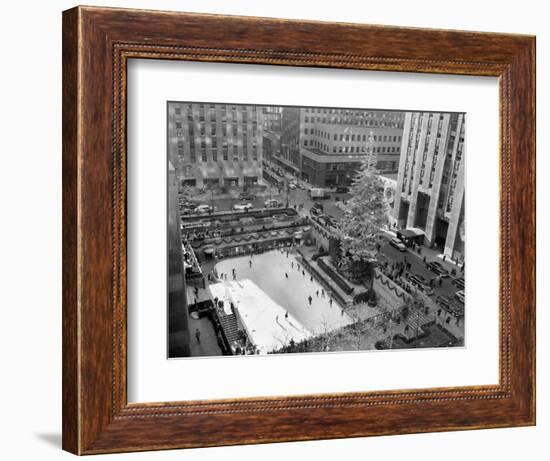 With the Famed Rockefeller Center Christmas Tree Rising Above Them, Skaters Glide on the Ice-null-Framed Photographic Print