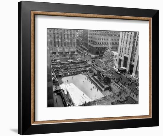 With the Famed Rockefeller Center Christmas Tree Rising Above Them, Skaters Glide on the Ice-null-Framed Photographic Print