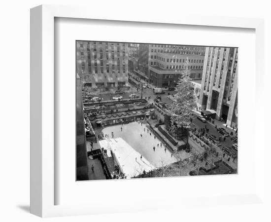 With the Famed Rockefeller Center Christmas Tree Rising Above Them, Skaters Glide on the Ice-null-Framed Photographic Print