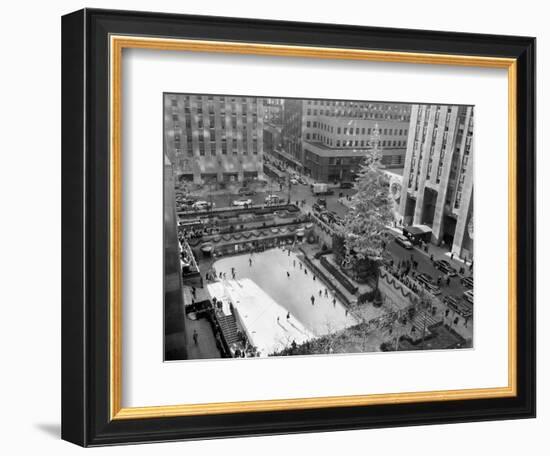 With the Famed Rockefeller Center Christmas Tree Rising Above Them, Skaters Glide on the Ice-null-Framed Photographic Print