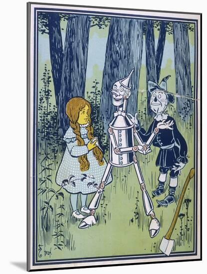 Wizard of Oz: Dorothy Oils the Tin Woodman's Joints-W.w. Denslow-Mounted Photographic Print