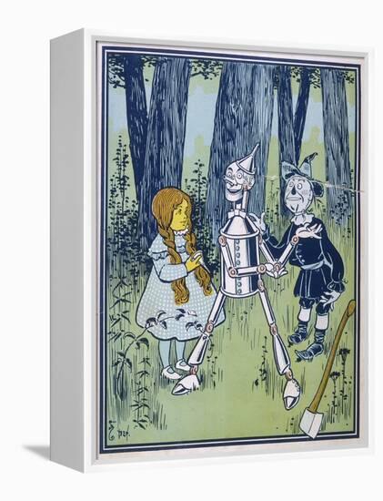 Wizard of Oz: Dorothy Oils the Tin Woodman's Joints-W.w. Denslow-Framed Premier Image Canvas