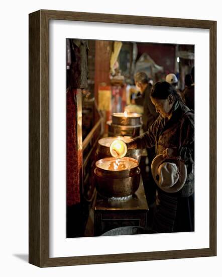 Woman Adding the Melting Yak Butter from Her Lamp to Those of the Temple, Bharkor, Tibet-Don Smith-Framed Photographic Print