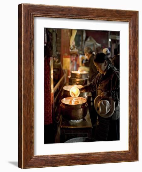 Woman Adding the Melting Yak Butter from Her Lamp to Those of the Temple, Bharkor, Tibet-Don Smith-Framed Photographic Print