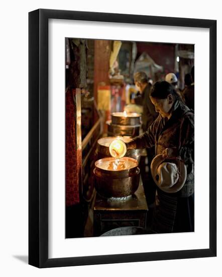 Woman Adding the Melting Yak Butter from Her Lamp to Those of the Temple, Bharkor, Tibet-Don Smith-Framed Photographic Print