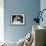 Woman and Man Sitting Together and Looking at a Book-null-Framed Photo displayed on a wall