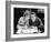 Woman and Man Sitting Together and Looking at a Book-null-Framed Photo