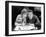 Woman and Man Sitting Together and Looking at a Book-null-Framed Photo