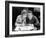 Woman and Man Sitting Together and Looking at a Book-null-Framed Photo