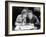 Woman and Man Sitting Together and Looking at a Book-null-Framed Photo