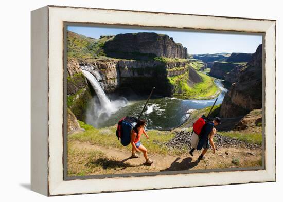 Woman And Man Wear Packs With SUP Gear, Hiking Into The Base Of Palouse Falls For An Afternoon-Ben Herndon-Framed Premier Image Canvas