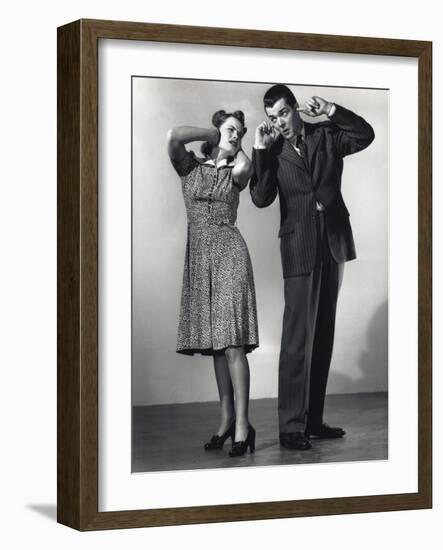 Woman and Man with Hands over Ears-Philip Gendreau-Framed Photographic Print