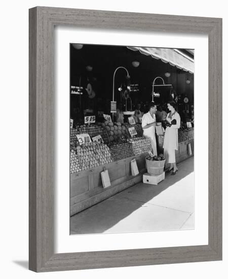 Woman and Vendor at Open Air Market-null-Framed Photo