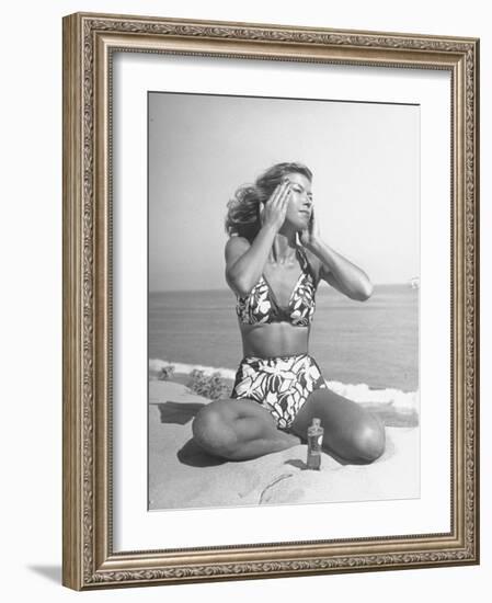 Woman Applying Suntan Lotion at the Beach-Peter Stackpole-Framed Photographic Print