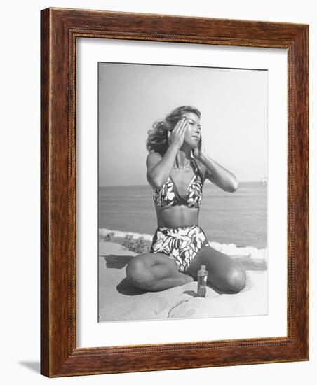 Woman Applying Suntan Lotion at the Beach-Peter Stackpole-Framed Photographic Print