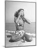 Woman Applying Suntan Lotion at the Beach-Peter Stackpole-Mounted Photographic Print