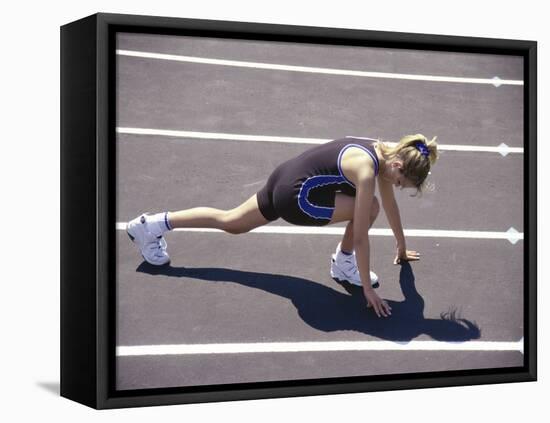 Woman at the Starting Pose on a Running Track-null-Framed Premier Image Canvas