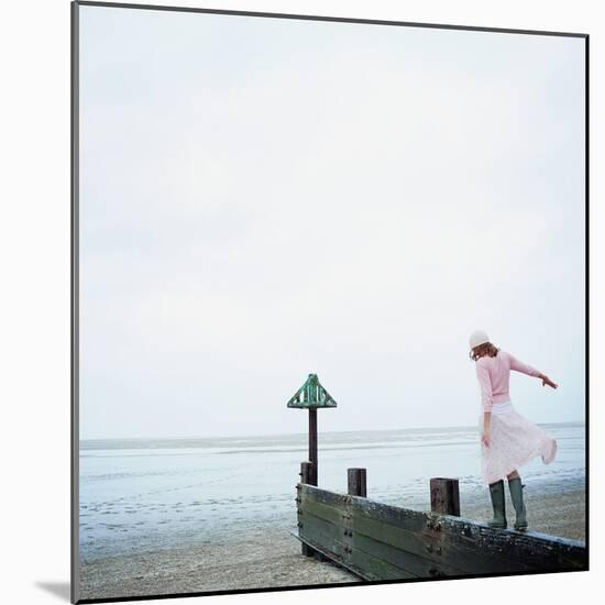 Woman Balancing on a Breakwater-null-Mounted Photographic Print
