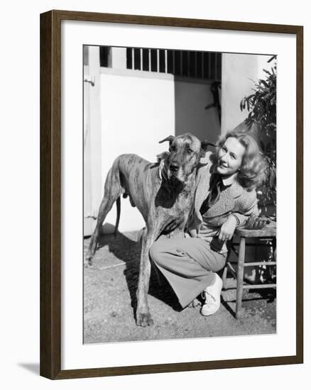 Woman Bending Next to Her Great Dane to Give Him a Hug-null-Framed Photo