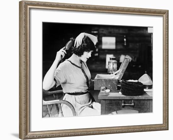 Woman Brushing Hair-null-Framed Photo