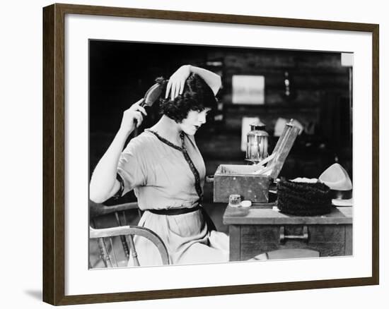 Woman Brushing Hair-null-Framed Photo