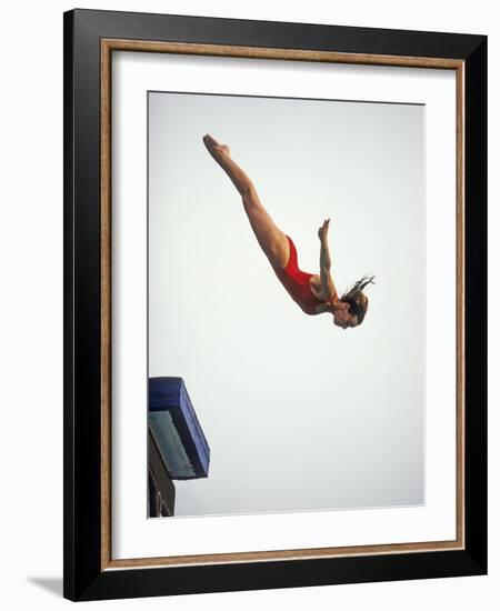 Woman Diver Flying Through the Air, California, USA-Paul Sutton-Framed Photographic Print