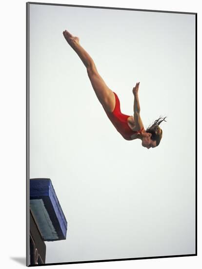 Woman Diver Flying Through the Air, California, USA-Paul Sutton-Mounted Photographic Print