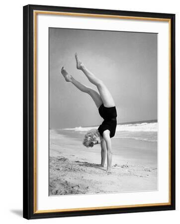 'Woman Does Handstand on the Beach (B&W)' Photographic Print