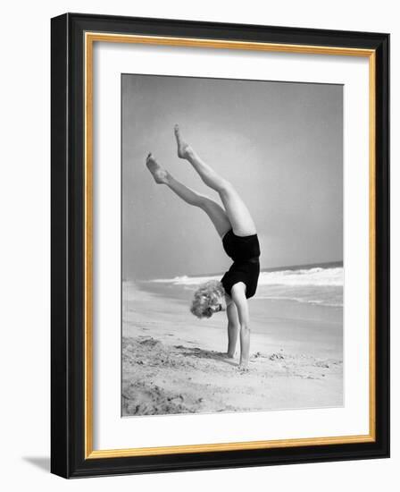 Woman Does Handstand on the Beach (B&W)-Hulton Archive-Framed Photographic Print