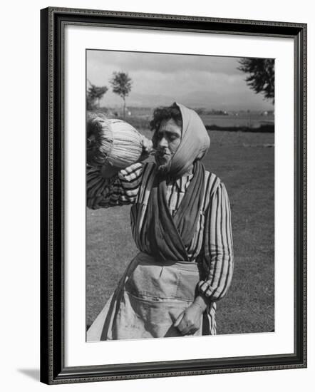 Woman Drinking a Bottles of Wine from a Story Concerning Italy-null-Framed Photographic Print