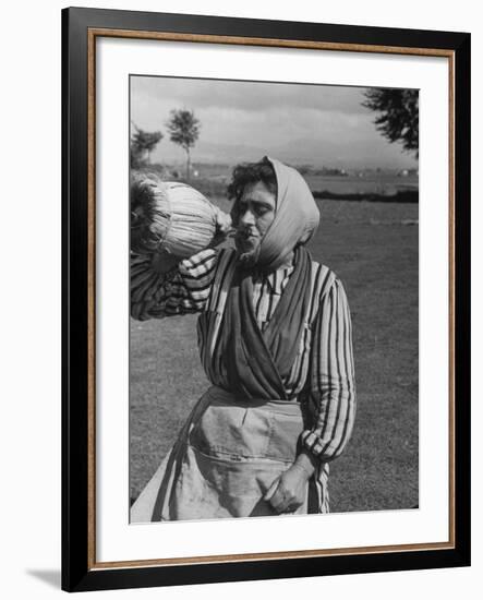 Woman Drinking a Bottles of Wine from a Story Concerning Italy-null-Framed Photographic Print