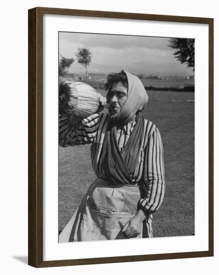 Woman Drinking a Bottles of Wine from a Story Concerning Italy-null-Framed Photographic Print