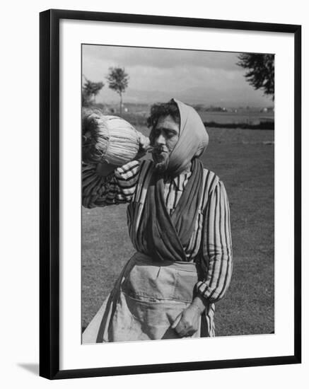 Woman Drinking a Bottles of Wine from a Story Concerning Italy-null-Framed Photographic Print