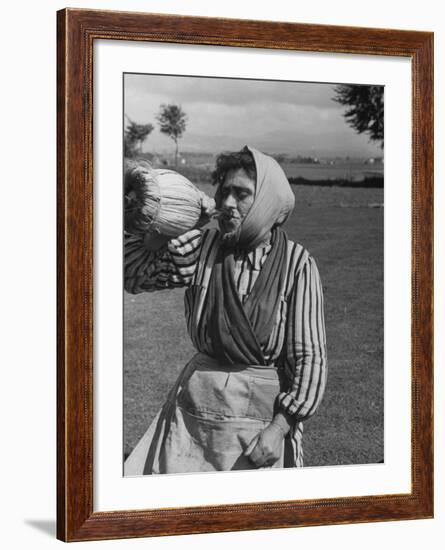 Woman Drinking a Bottles of Wine from a Story Concerning Italy-null-Framed Photographic Print