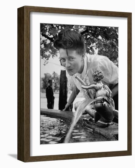 Woman Drinking from a Water Fountain-Yale Joel-Framed Photographic Print