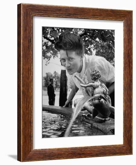 Woman Drinking from a Water Fountain-Yale Joel-Framed Photographic Print