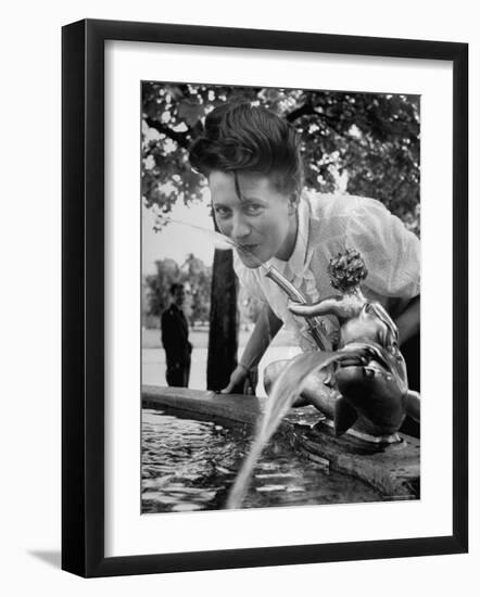 Woman Drinking from a Water Fountain-Yale Joel-Framed Photographic Print