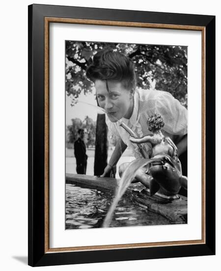 Woman Drinking from a Water Fountain-Yale Joel-Framed Photographic Print