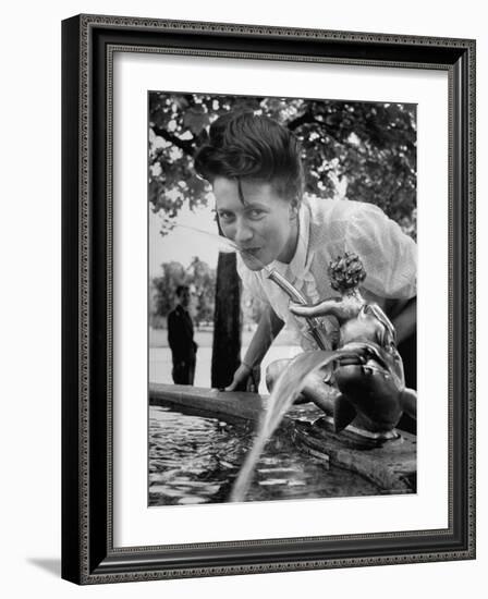 Woman Drinking from a Water Fountain-Yale Joel-Framed Photographic Print